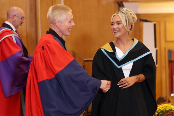 Graduates receiving their award